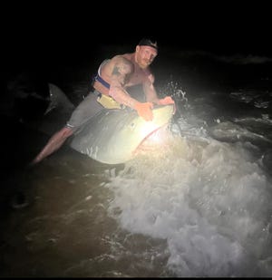 Christian Halterman involved a 12.5-foot tiger shark while fishing on the Paddley Island National Coast with his son in May 2022.