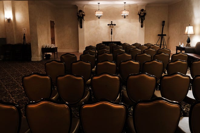 Empty seats are seen at the Gerald Neufeld Funeral Home, which had been overwhelmed with the deceased during the COVID-19 pandemic, has now returned to a quieter atmosphere on March 12, 2022, in the Elmhurst neighborhood of the Queens borough in New York City.