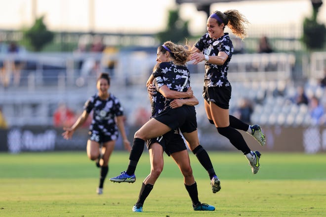 May 18, 2022; Louisville, Kentucky, USA; The Racing Louisville FC celebrate Racing Louisville FC player Savannah Demelo (7) goal during the second half against the San Diego Wave FC at Lynn Family Stadium. Mandatory Credit: Aaron Doster-USA TODAY Sports