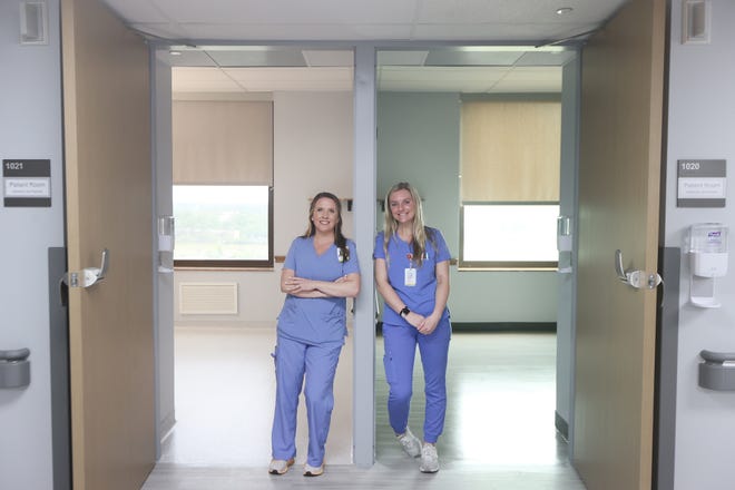 Nurses Amber Webb, left, and Lindsay Hale inside Saint Francis' Hospital's new oncology training wing, where experienced nurses will team with new care givers for a hands-on learning experience that was lost during portions of the pandemic where bedside training was replaced with remote learning. 