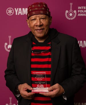 Jonathan Øverby, host of Wisconsin Public Radio's “The Road to Higher Ground,” receives his induction into the Folk Alliance International’s Folk DJ Hall of Fame on May 18, 2022, in Kansas City.