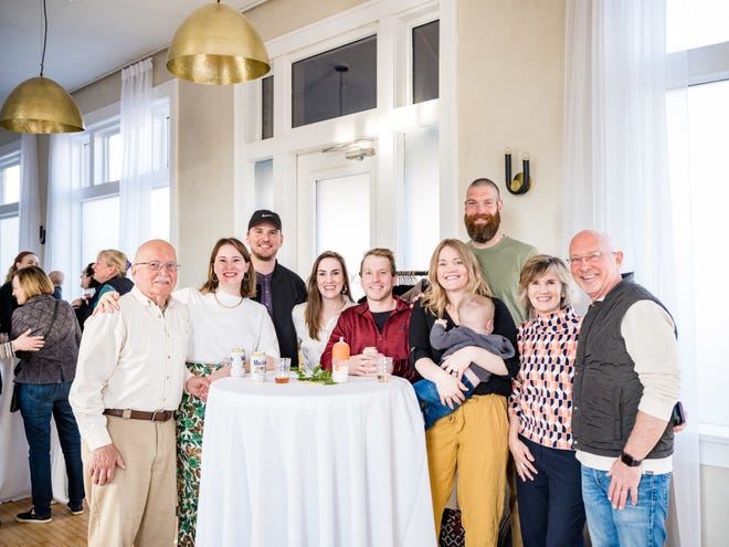 Hannah Sammons and her family celebrate during the Eden Space launch party on April 28 at Convolo in Sioux Falls. From left: Robert Sammons, Hannah Sammons, Elliot Sammons, Rachel Sammons, Andrew Sammons, Kelsey Whitesel and baby Elden, Bryan Whitesel, Jennifer Sammons and Eric Sammons.