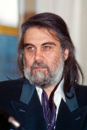 Vangelis Papathanassiou poses at the French Culture Ministry after receiving a decoration on Oct. 20, 1992. The Greek musician and composer has died at the age of 79.