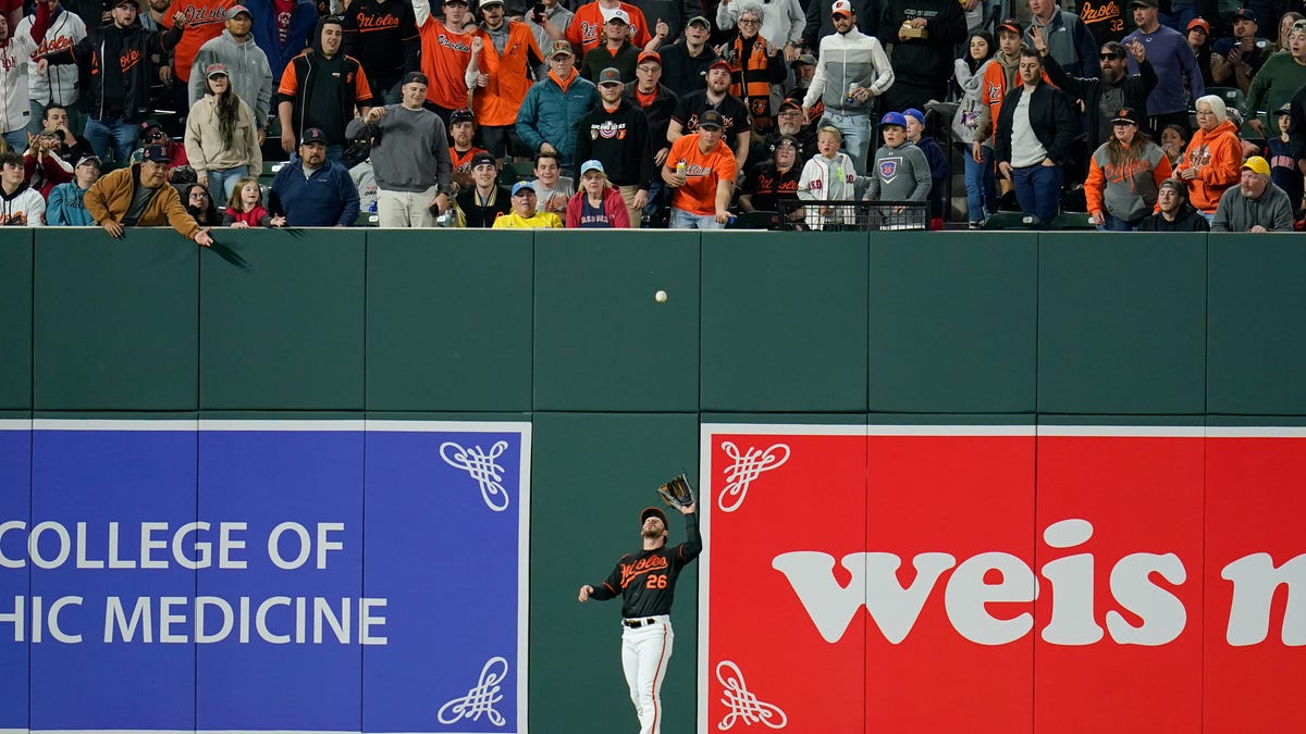 Orioles left fielder Ryan McKenna makes a catch near the new left field wall at Camden Yards during an April game against the Red Sox.