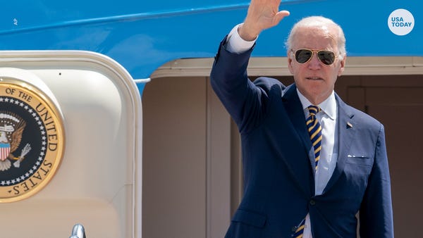 President Joe Biden waves as he boards Air Force O