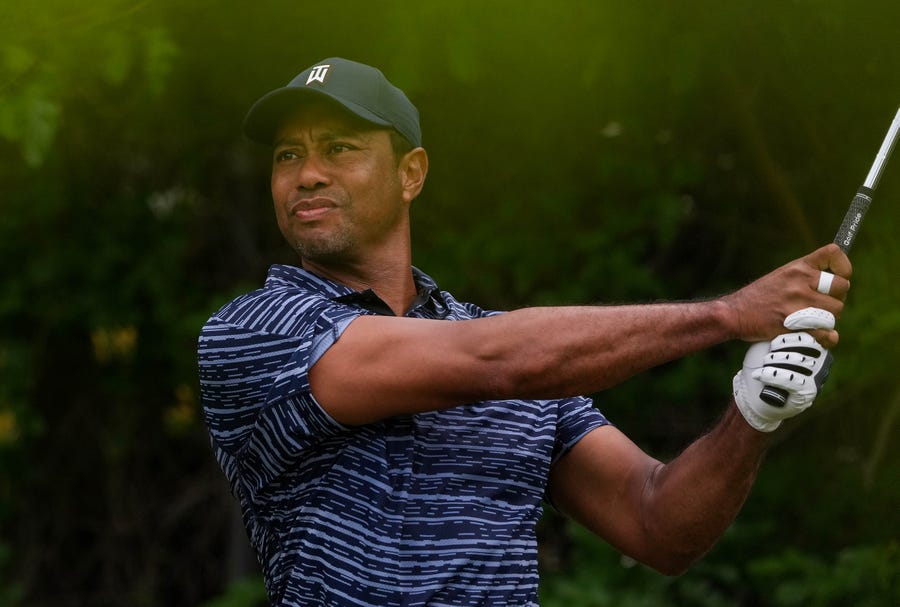 Tiger Woods tees off at the 12th tee during the first round of the PGA Championship golf tournament.