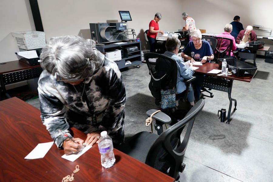 Election workers continue the process of counting ballots for the Pennsylvania primary election, Wednesday, May 18, 2022, at the Mercer County Elections Board in Mercer, Pennsylvania.