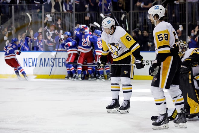 Pittsburgh Penguins defenseman John Marino (6) reacts after New York Rangers left wing Artemi Panarin scored the game winning goal during overtime in Game 7 of an NHL hockey Stanley Cup first-round playoff series, Sunday, May 15, 2022, in New York. The Rangers won 4-3 in overtime. (AP Photo/Adam Hunger)