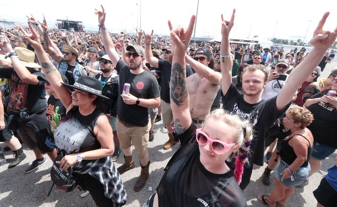 Rock music fans watch the shows, Friday, May 20, 2022, as Rockville rocks the Daytona International Speedway. This year's show is scheduled for May 18-21.
