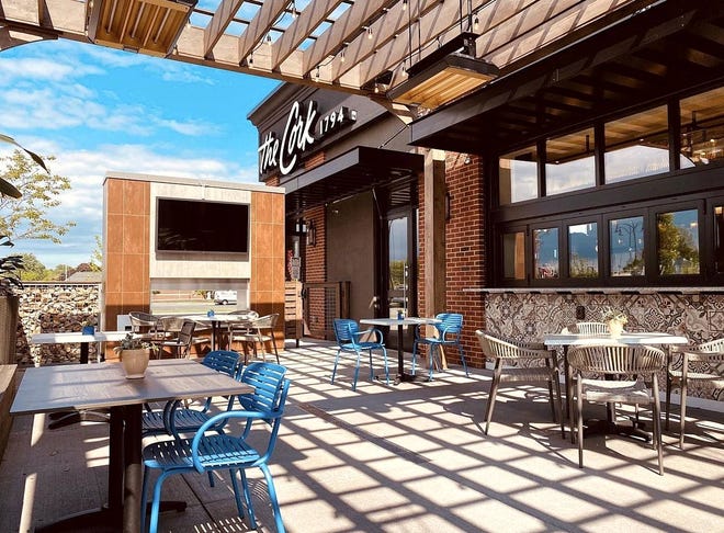 The patio at The Cork 1794, 900 West Erie Plaza Drive, offers a filtered-sunlit area for dining outside.