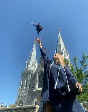 Burlington native Lydia Becker celebrates graduation from Villanova University May 17 in front of the St. Thomas of Villanova Church. Becker graduated the college with a double-major bachelor’s degree in Criminology and Sociology, with a minor in Spanish. She's headed to the University of Maryland to continue her studies.