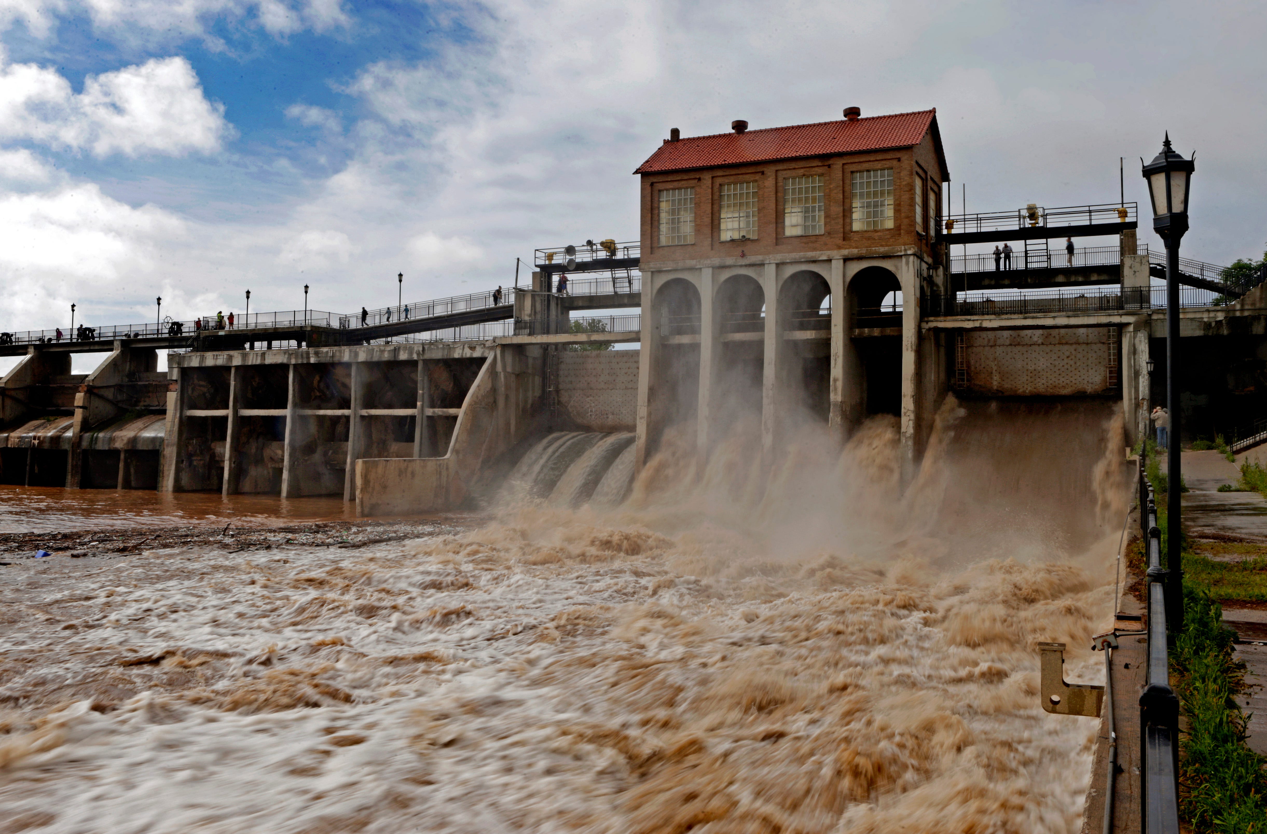 Water flows at the Lake Overholser Dam in Oklahoma City  after days of heavy rain in central Oklahoma on Saturday, May 9, 2015. Photo by Bryan Terry, The Oklahoman