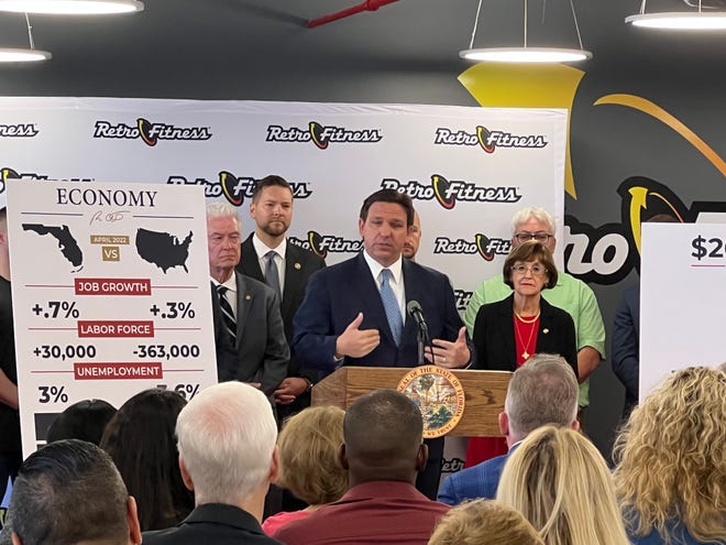 Gov. Ron DeSantis speaks during a news conference at Retro Fitness in West Palm Beach.