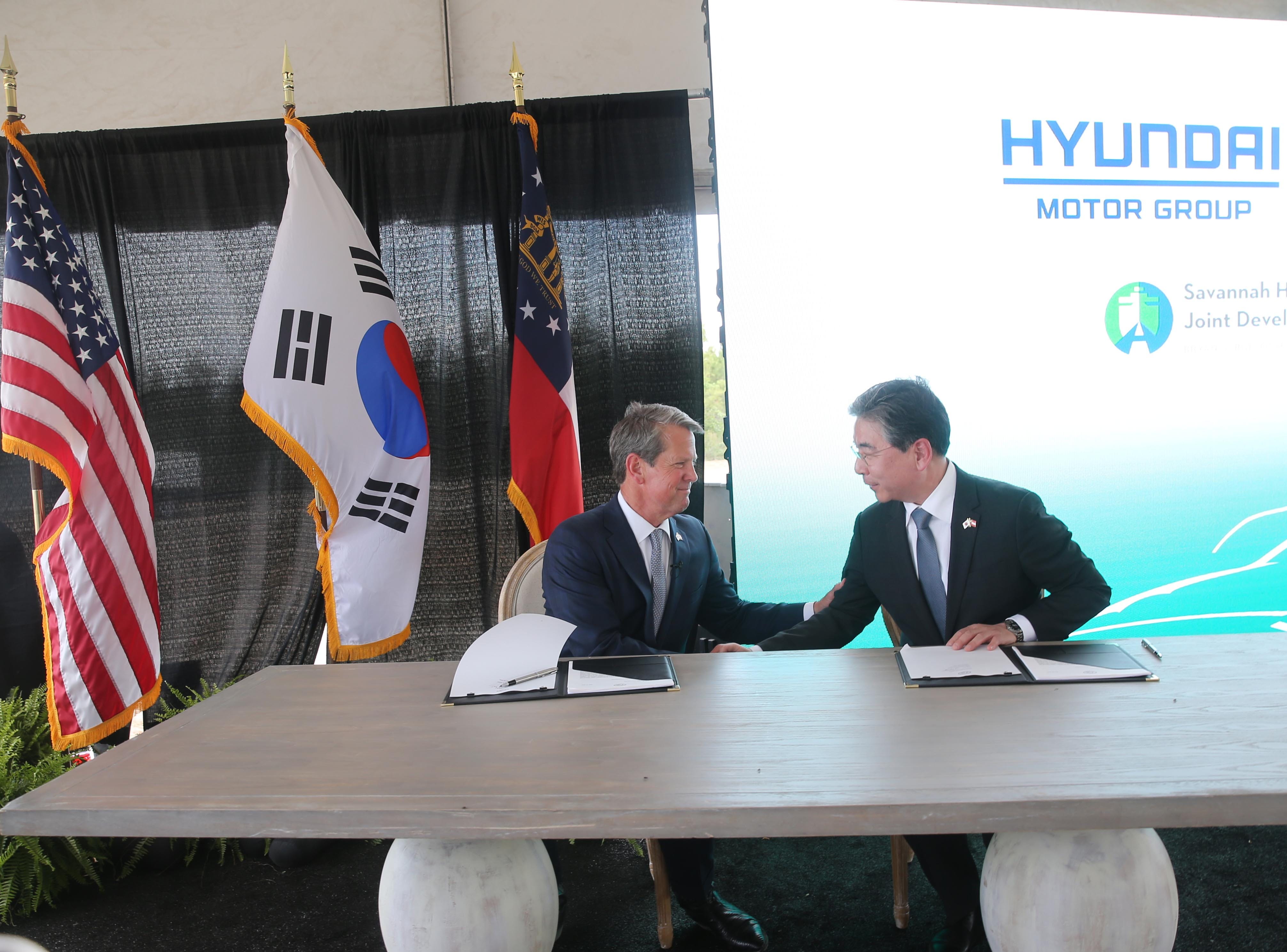 Georgia Governor Brian Kemp and Jaehoon "Jay" Chang, Hyundai Motor Company President and CEO, Shake hands after signing an agreement on Friday May 20, 2022 to finalize a deal for Hyundai Motor Group to build a manufacturing plant in Ellabell Georgia.