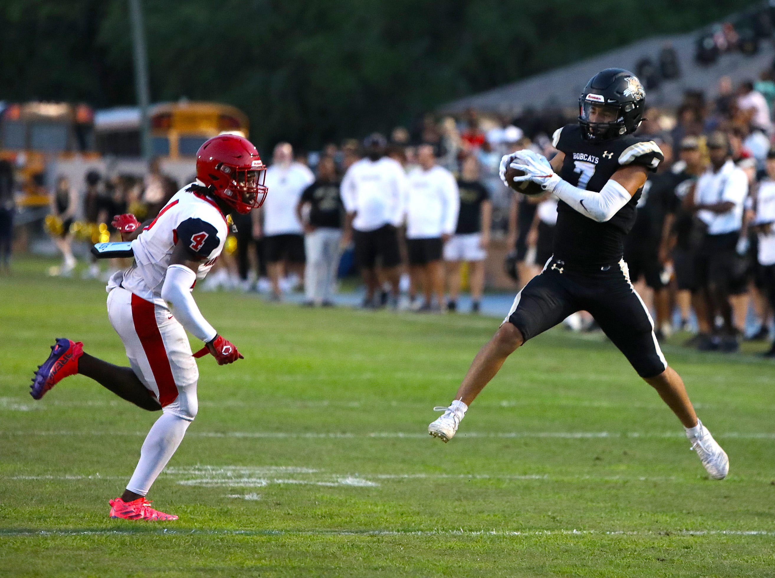 Buchholz High School's David Schmidt (7) makes a catch during the spring football game between the Bobcats and Vanguard High School, held at Citizens Field in Gainesville on May 19.