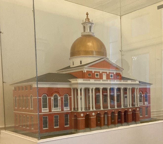 A scale replica of the Massachusetts State House in its original form. It has grown considerably since then.