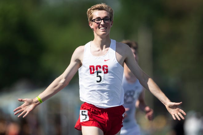 Dallas Center-Grimes' Aidan Ramsey smiles as he wins the 3,200-meter run finals during the 2022 Iowa high school track and field state championships at Drake Stadium in Des Moines on Thursday, May 19, 2022.