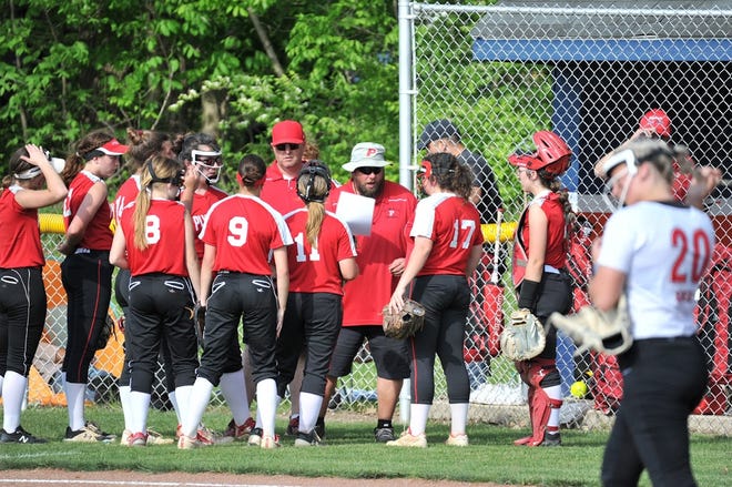 Plymouth coach Byron Bailey talks with his team between innings during the Division IV District Softball Final in Galion Thursday evening.