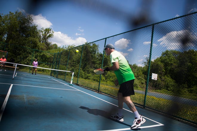 People play pickle ball at Deacons Walk Park Tuesday, May 17, 2022. 