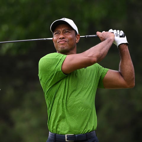 Tiger Woods plays his shot from the seventh tee du