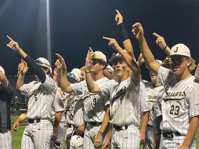The Johnson players salute their fans after defeating Cedar Park 4-0 in a Class 5A playoff game Friday night at Concordia University Texas. The Jaguars scored all their runs in the first inning and advance to the regional semifinals.