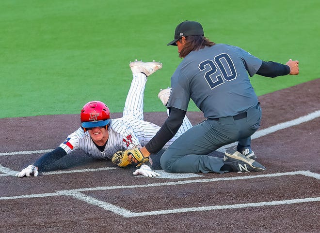 Lake Travis outfielder Daniel Ripple slides safely at the plate as San Antonio Clark pitcher Jack Jouett applies the late tag in Friday's Class 6A Region IV quarterfinal. The Cavs won 7-0 to complete the series sweep.