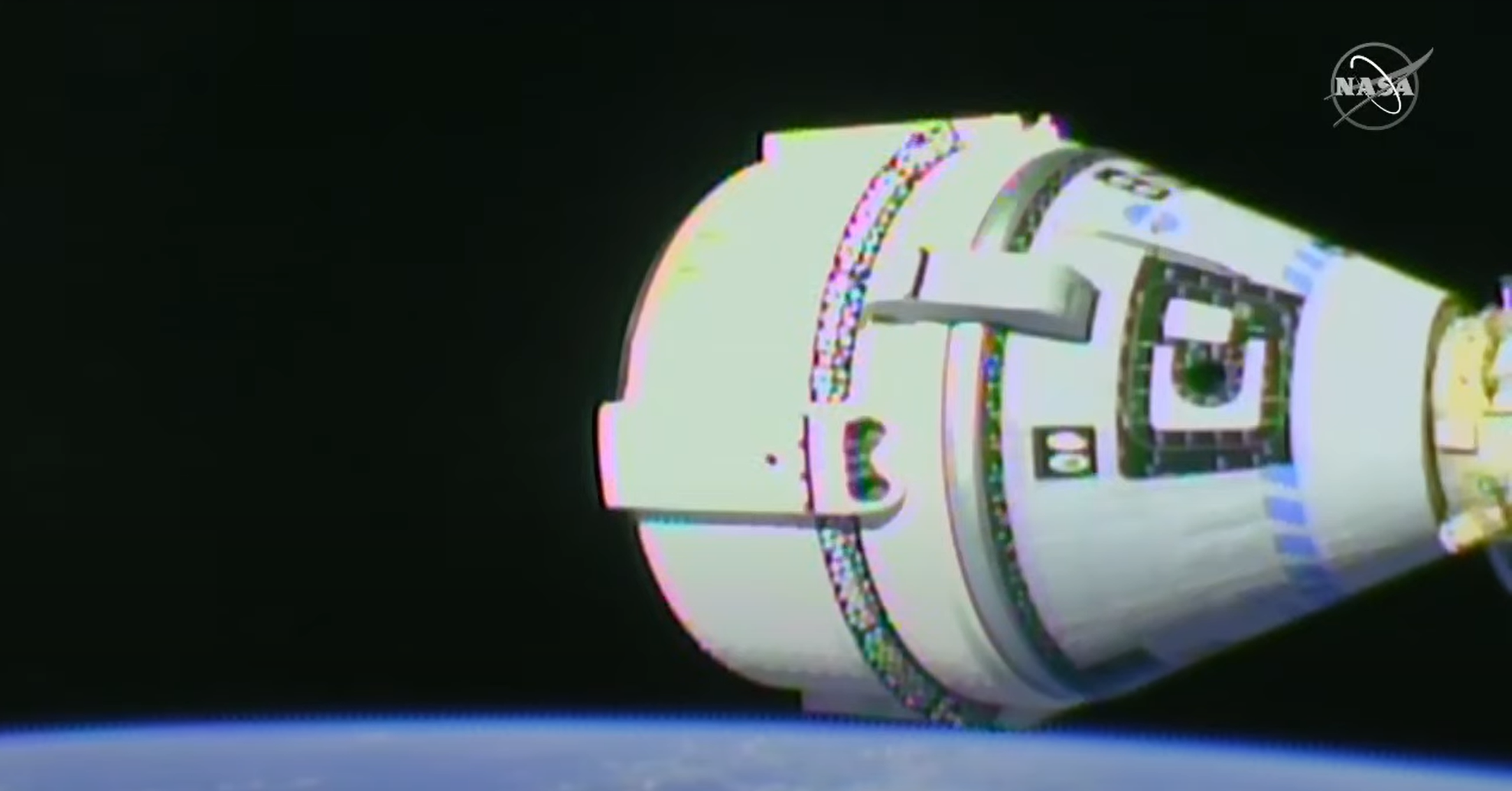 A screen capture of the Boeing Starliner capsule docked for the first time to the International Space Station during NASA's Commercial Crew Program OFT-2 mission.