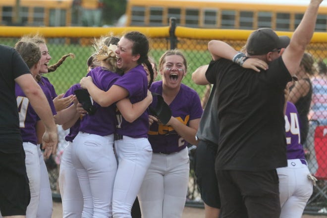 Lexington's Kylie Gottman (hugging) celebrates the Division II district championship, Lady Lex's first in 11 years.