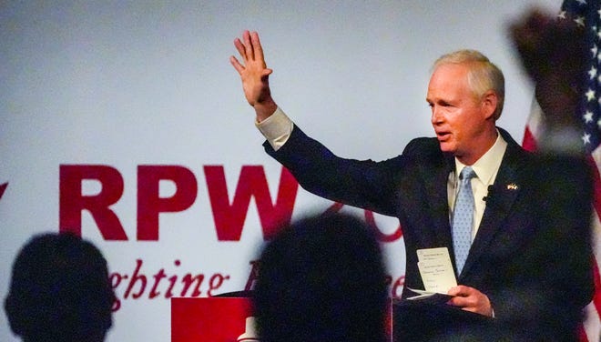 A supporter raises his fist after U.S. Sen. Ron Johnson says his final thoughts during the 2022 state Republican Party convention in Middleton Saturday, May 21, 2022. "Fighting for Freedom" is the theme of this year's convention.
