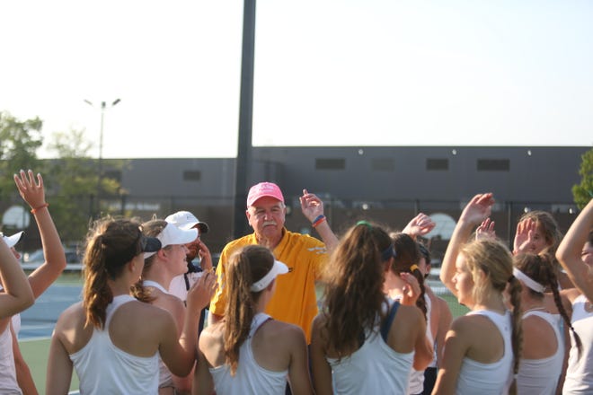 Delta girls tennis head coach Tim Cleland speaks to his team after winning its 30th sectional title in program history at Delta High School on Friday, May 20, 2022.