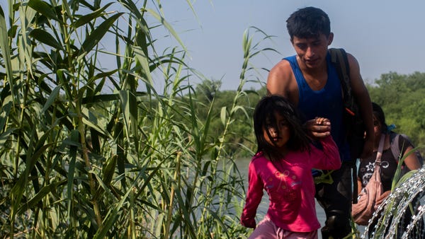 EAGLE PASS, TEXAS - MAY 21: A migrant family from 