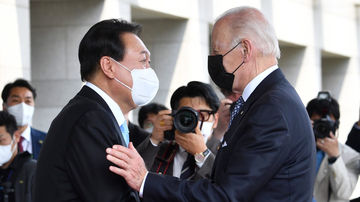 May 21, 2022: South Korean President Yoon Suk Yeol, left, greets U.S. President Joe Biden prior to their summit meeting at the People's House in Seoul, South Korea. 