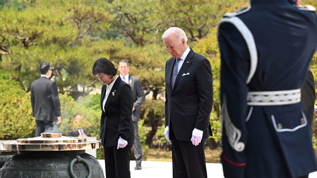 President Joe Biden participates in a wreath laying ceremony in honor of those who died in the Korean War at the National Cemetery in Seoul on May 21, 2022.