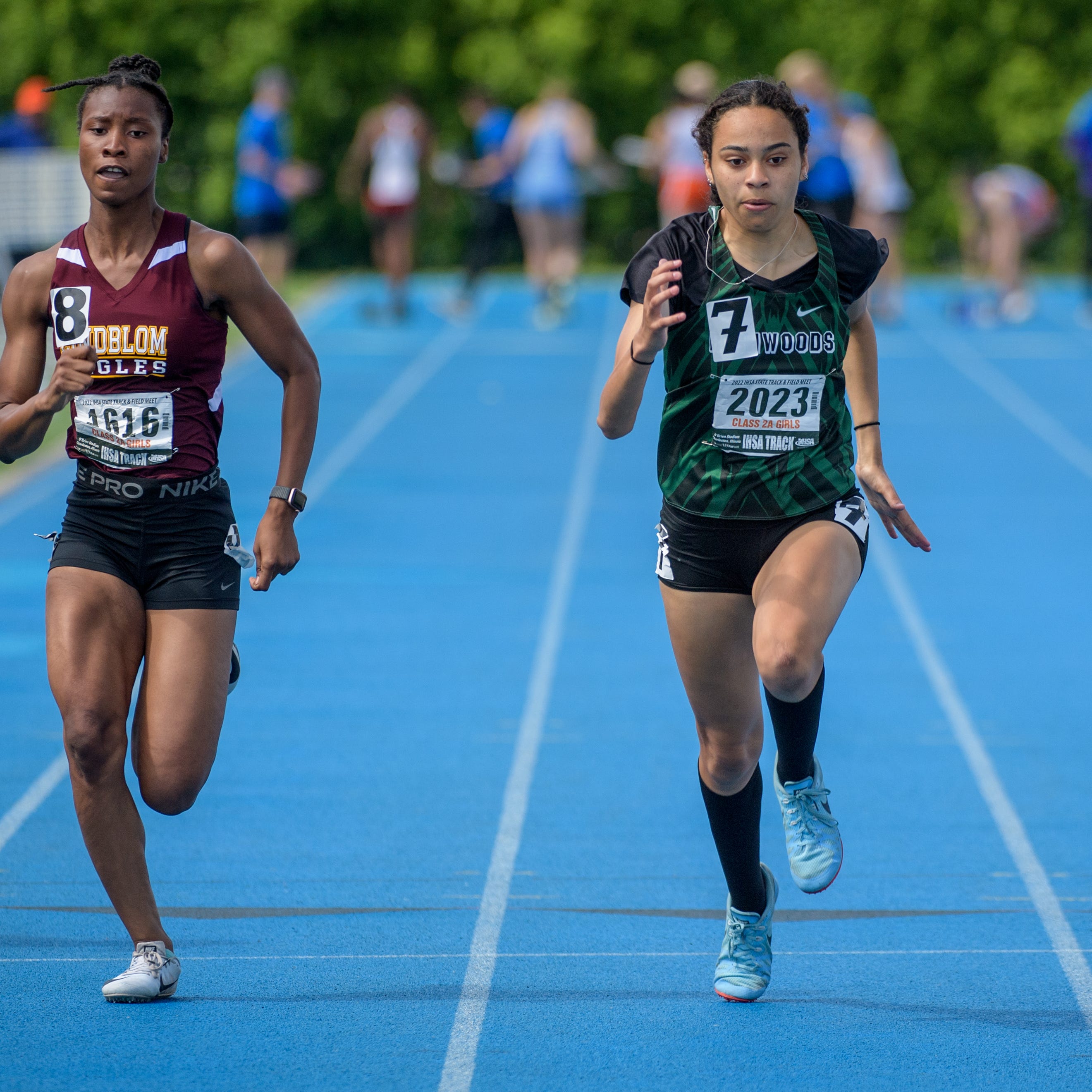 Richwoods' Lena Jackson, middle, sprints against Symone Frison of Chicago Lindblom, left, and Lamonyca Bryant of Chicago Westinghouse in the 100-meter dash during the Class 2A State Track and Field Championships on Saturday, May 21, 2022 at Eastern Illinois University. Jackson took fourth place while Bryant placed second and Frison finished in sixth place.