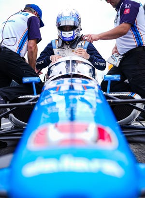 Chip Ganassi Racing driver Álex Palou (10) climbs in his car during morning practice before the second session of qualifying for the 106th running of the Indianapolis 500 on Sunday, May 22, 2022, at Indianapolis Motor Speedway, in Indianapolis. 