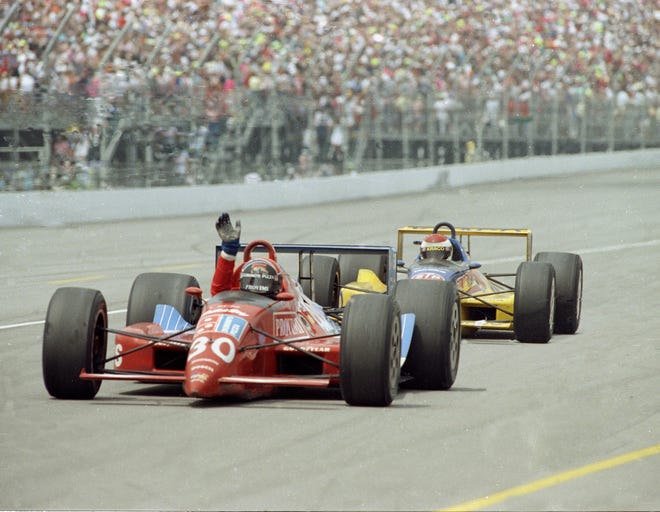Arie Luyendyk waves to the crowd after winning the 74th running of the Indianapolis 500 on May 28, 1990.