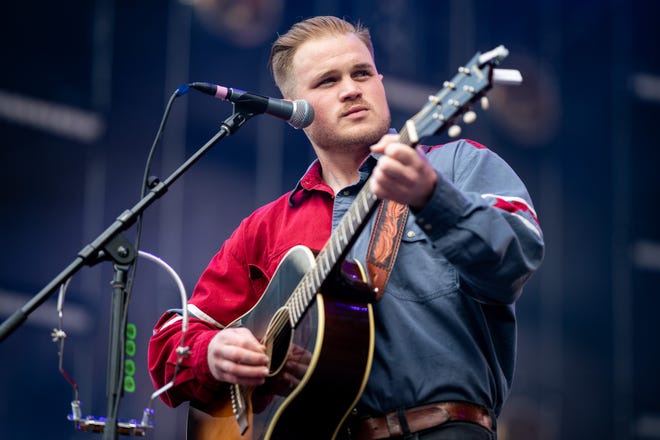 Zach Bryan opens for Luke Combs at Empower Field at Mile High in Denver, Colorado on Saturday, May 21, 2022. The show kicked off Combs' first-ever headlining stadium tour.