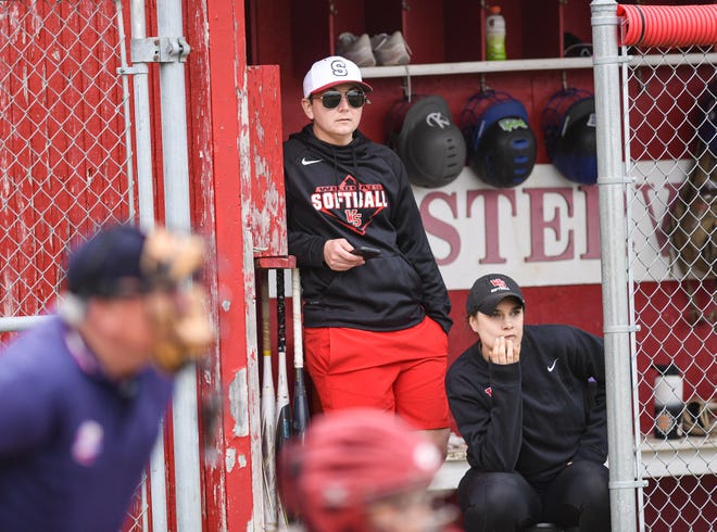 South softball coach Emily Swank-Kavanaugh (left) and assistant coach Kim Swank look on during a game against Westerville North on April 15.  Swank-Kavanaugh has stepped down after four seasons.