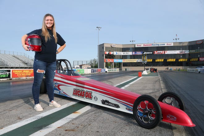 Canal Winchester High School graduate Sarah Bazell is shown with her junior dragster May 12 at National Trail Raceway in Hebron. Bazell, who has been racing since she was 10, travels across the Midwest competing with Bazell Family Racing.