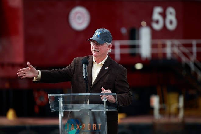 U.S. Rep. John Rutherford, shown speaking during a ceremony for completing deepening of the St. Johns River for cargo ships, was cleared by the House Committee on Ethics of any intentional violations of reporting requirements for stock transactions.