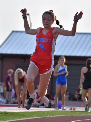 Owen Valley's Emma Bault makes a leap during the long jump at the Bloomington North sectional on May 17, 2022. With this jump, Bault advanced to regional competition.