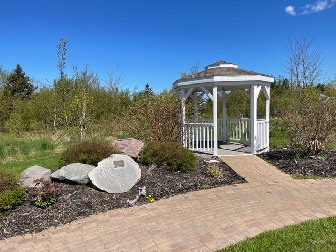 A gazebo in the brick garden at Hospice of the EUP is shown.