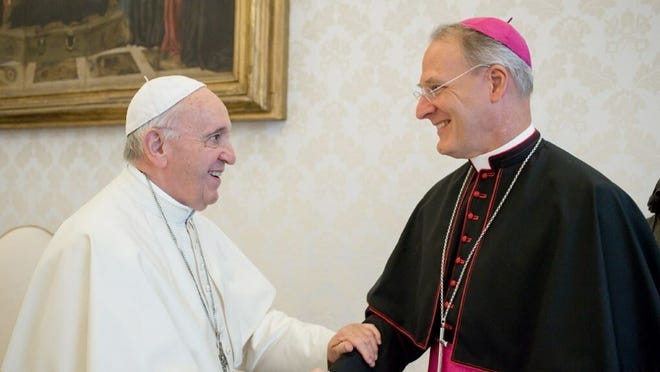Archbishop Paul Fitzpatrick Russell, then apostolic nuncio to Turkey, Turkmenistan and Azerbaijan, greets Pope Francis at the Vatican on Sept. 13, 2018.