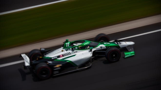 Juncos Hollinger Racing driver Callum Ilott (77) heads into turn one Monday, May 23, 2022, during practice in preparation for the 106th running of the Indianapolis 500 at Indianapolis Motor Speedway. 