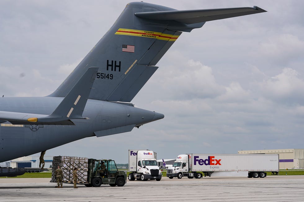 132 pallets of Nestlé Health Science Alfamino Infant and Alfamino Junior formula are transferred to a truck after arriving on an Air Force C-17 at the Indianapolis International Airport May 22, 2022.