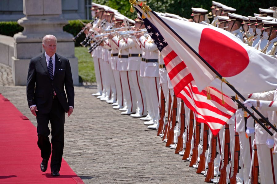 President Joe Biden reviews an honor guard May 23 during a welcome ceremony at the Akasaka Palace state guesthouse in Tokyo.