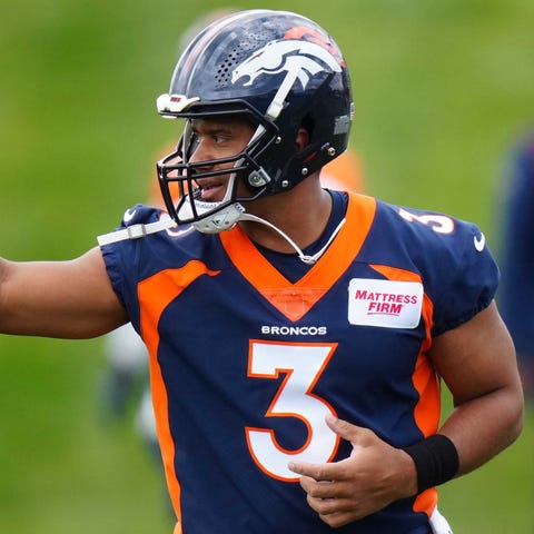 Russell Wilson takes part in the Broncos' OTA work