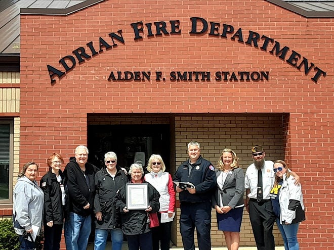 The Veterans of Foreign Wars (VFW) Post No. 1584 and Auxiliary of Adrian recognized Loyalty Day in Adrian with ceremonies April 29. Nationally, Loyalty Day is recognized May 1. Pictured, from left, are those who presented American flags and a proclamation to the Adrian Fire Department for Loyalty Day. They are, Mickey Contos, Susan Huetter, Steve and Jan Carr, Auxiliary president Edith Noveskey, Auxiliary Americanism chairman Brenda Schug, Adrian Fire Chief Aric Massingill, Adrian Mayor Angie Sword Heath and VFW Post Commander Jim Flarity and his wife, Fallon.