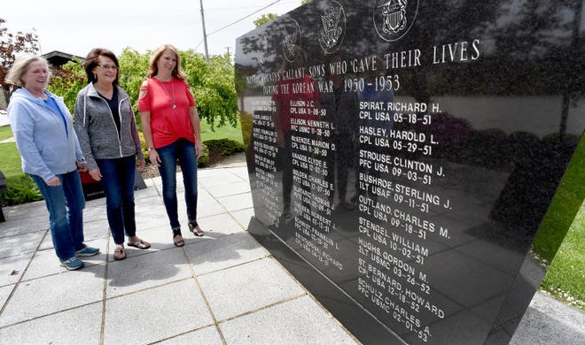 In 2020, sisters Donna Carpenter (from left), Cheryl Stein and Angie Barron visited the Korean War Memorial at Veterans Park, where their uncle, U.S. Army Pvt. Norbert Theisen, who died in 1951 as a prisoner of war, is memorialized. [MONROE NEWS PHOTO BY TOM HAWLEY]