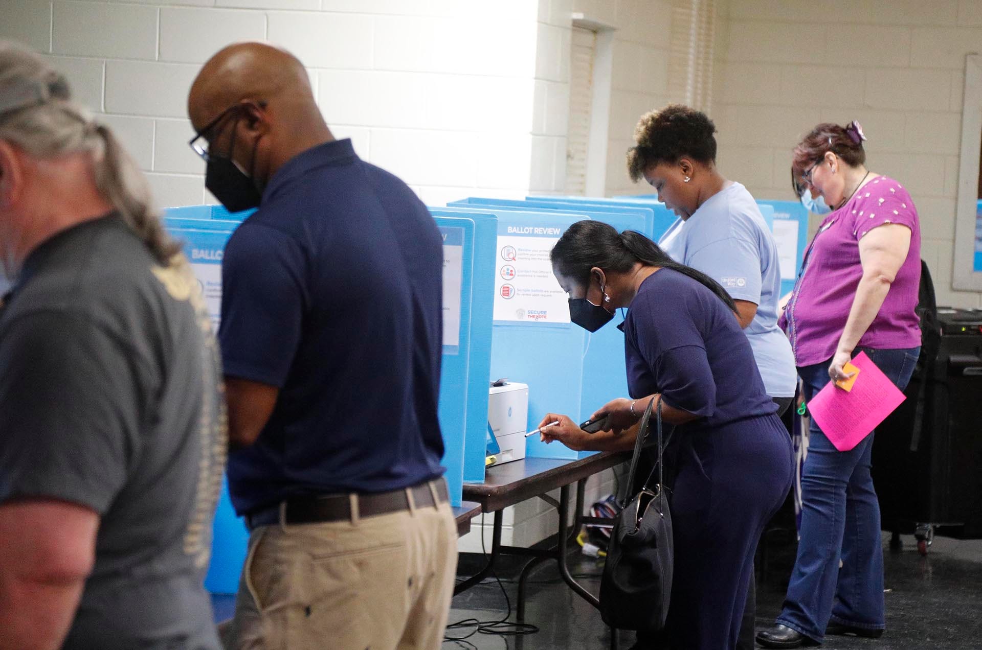 Voters cast their ballots in the 2022 primary on May 24 in Garden City, Ga. Voter turnout in the Georgia primary rose across every demographic, an analysis by the USA TODAY Network found.